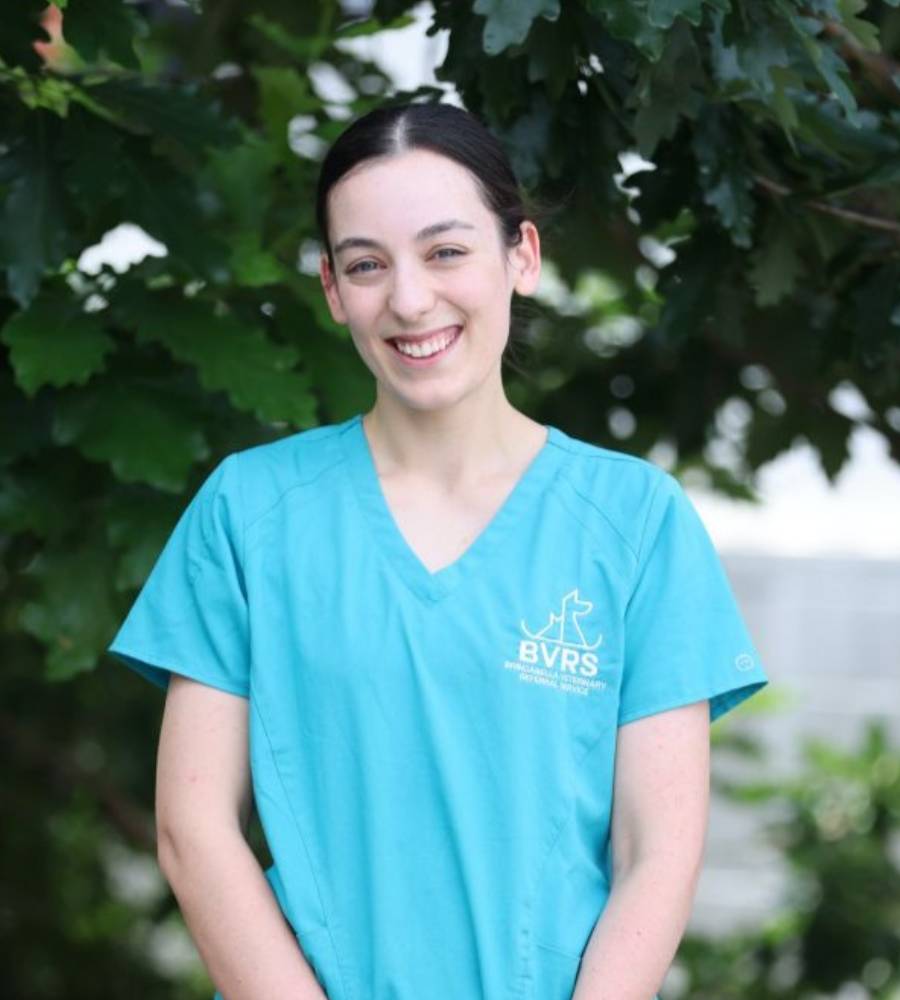 medical staff standing and smiling outside