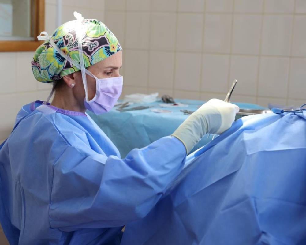 Surgeon performing medical operation.