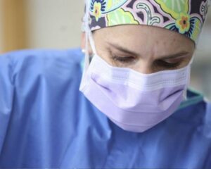 Surgeon in mask and cap