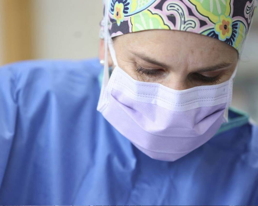 Surgeon in mask and cap